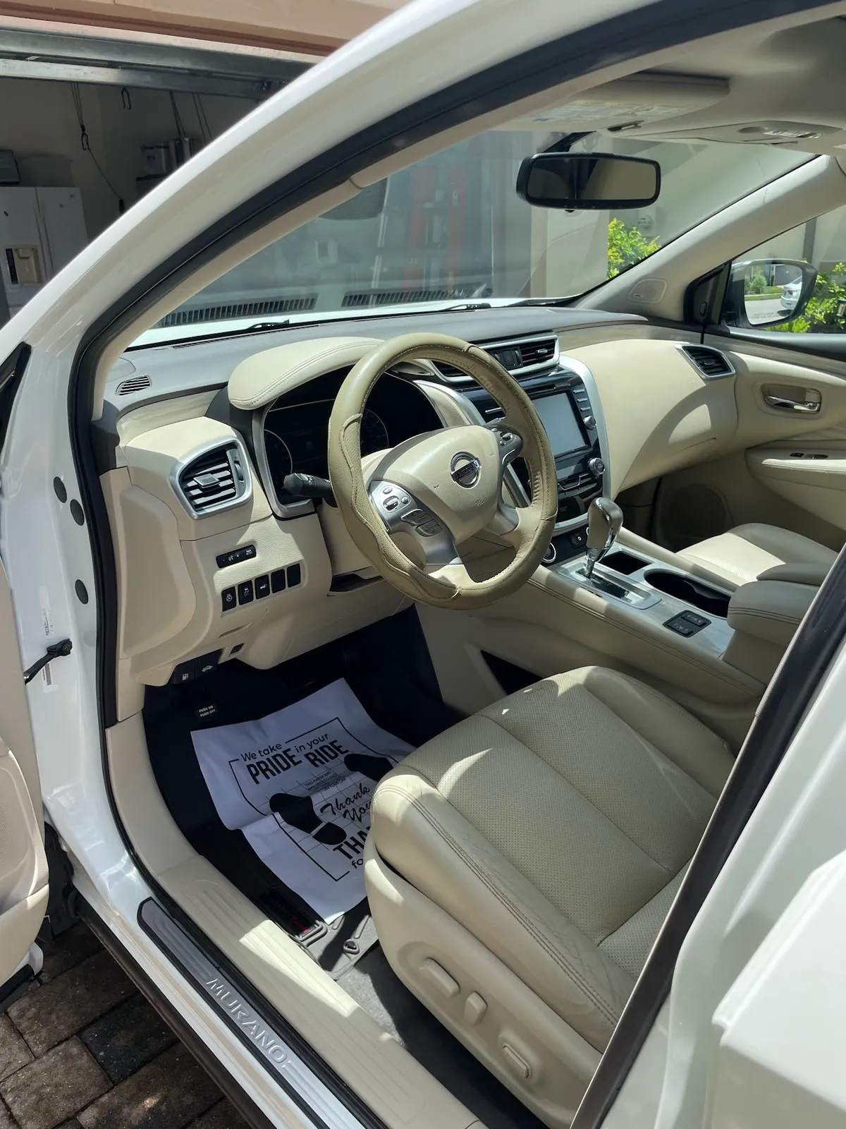 Nissan Murano beige tan leather interior cleaned and conditioned in North Port, FL by Sansanich Car Detailing