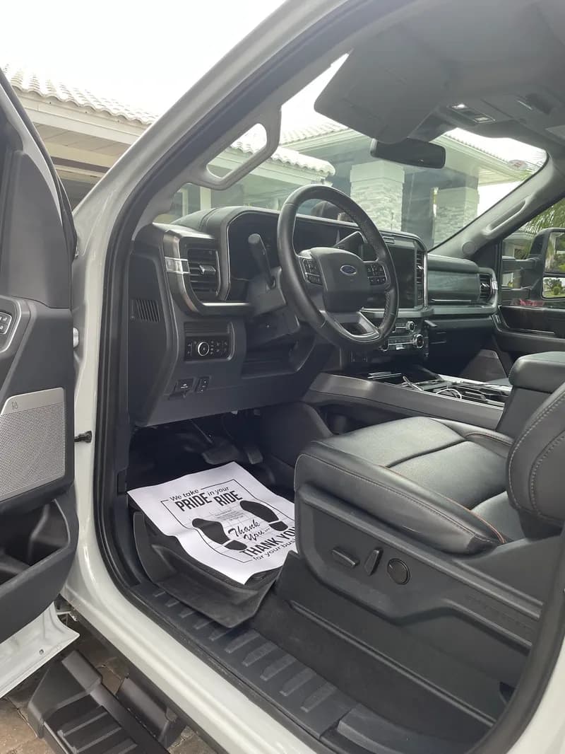 Black leather truck interior after professional interior detailing in North Port, FL