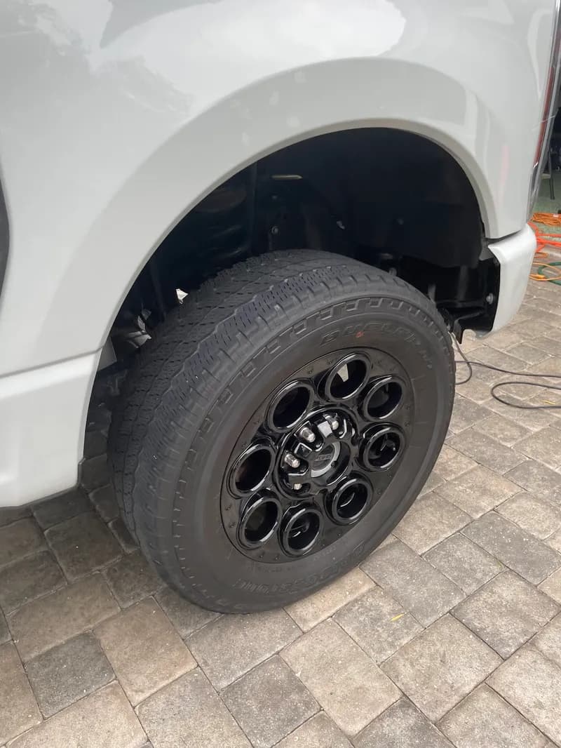 Detailed black truck wheel and tire in North Port, FL